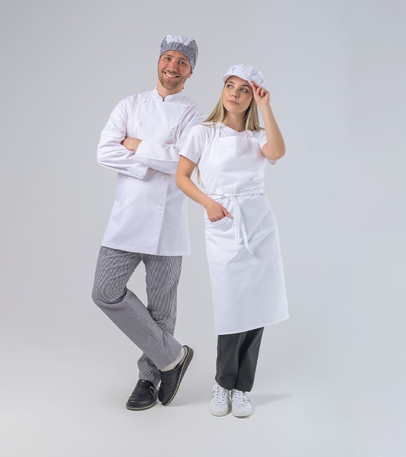 Luxury hotel bathroom with fluffy white towels and bathrobes folded